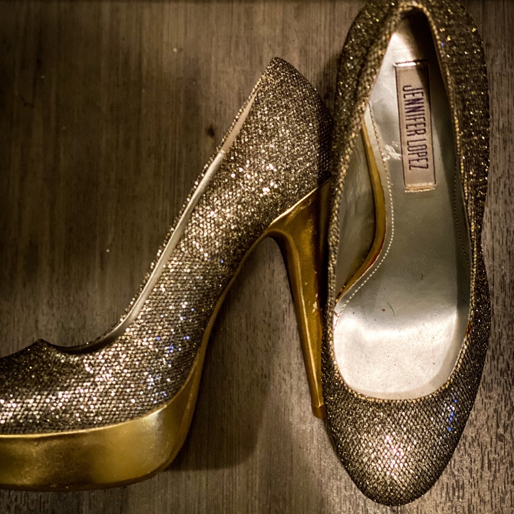 Jennifer Lopez silver and gold platform heels.